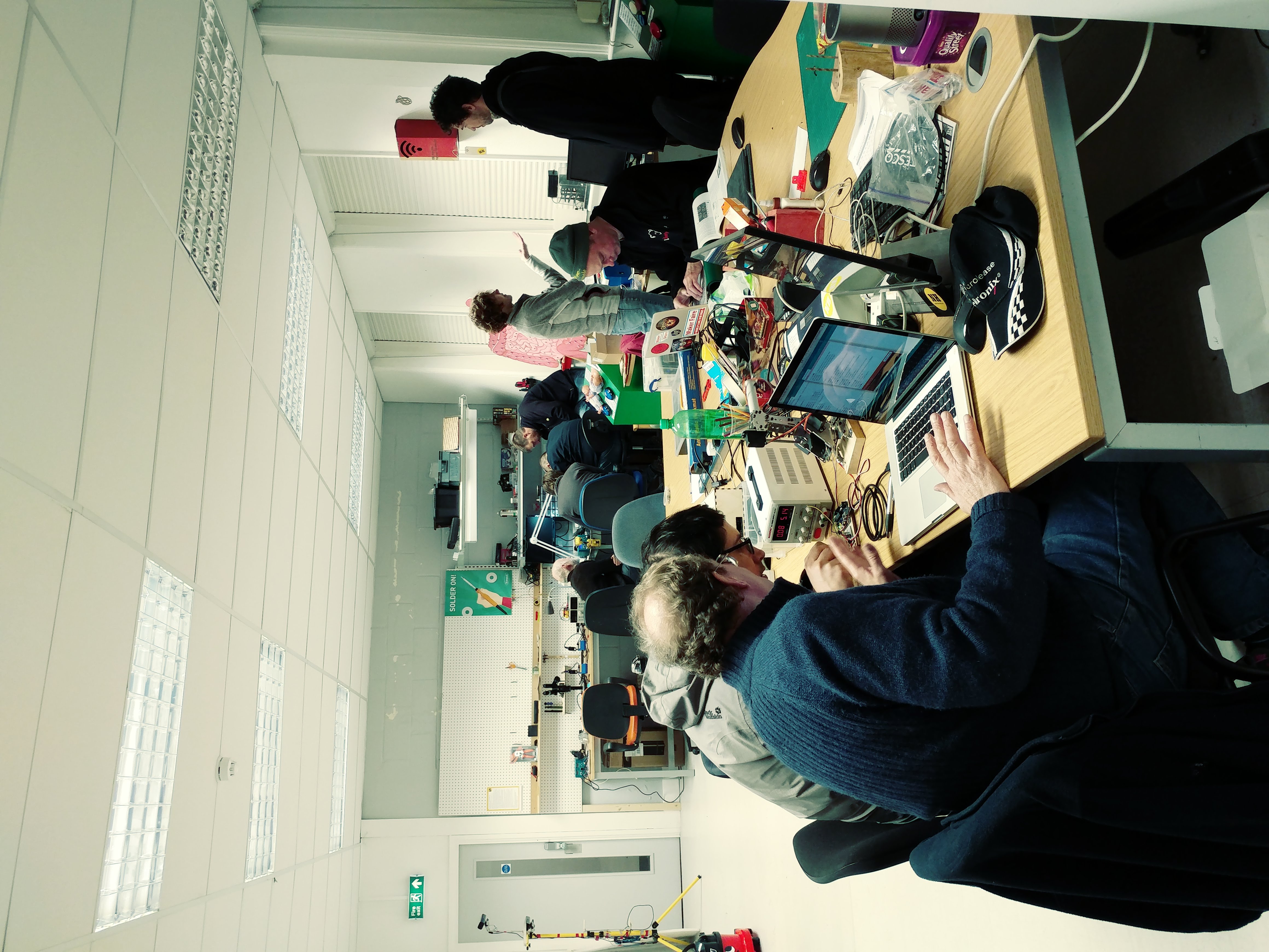 Norwich Hackspace main area showing central desk and electronics bench
